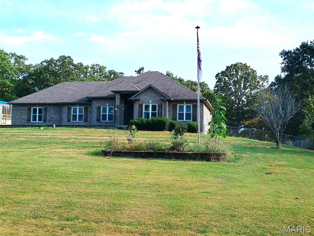 VIP 4981  
JUST REDUCED!!!  PRICED BELOW APPRAISAL! Custom Built Country Home boasts 5 Bedroom 3.5 Bath Brick home with custom mill work throughout the home, 2 car attached garage with additional garage for mowers, etc. and storage in garage.  Has a 20 x 60 Greenhouse on the property as well for those gardeners!   
Property is not in City Limits and has Intercounty Electric and County #2 water. 
Main home Kitchen has lots of Custom Cabinetry , beautiful Center Island, Wine Cooler, Microwave and so many additional touches! Separate Dining area with wood flooring, Living Room with 11 foot ceilings and a view of the Patio leading out to the In Ground Pool with a slide.
 BONUS is a 16 x 60 Green House with an outside Wood Furnace that can heat the Main Home and water. Main home has a Lenox Heat Pump with electric backup.  Workshop has a gravel floor. Utility shed also on property.