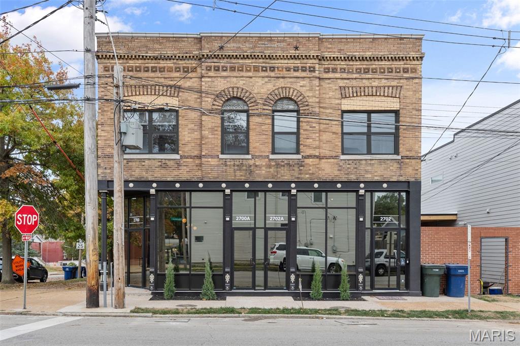 2700 Macklind Avenue is a renovated mixed-use property along the Macklind Avenue business corridor in St. Louis, just steps from The Hill, combining neighborhood commercial space with residential income. This property would be ideal for an owner occupant seaking a live-work setup with income to support the property. The 4,320-square-foot building contains four rentable spaces: two residential apartments and two commercial suites. Current contracted rent totals $5,870 per month, diversifying income across residential and commercial uses. Improvements include upgraded electrical and plumbing systems, tuckpointing, new front sidewalks, and restoration of the historic storefront with new commercial windows and doors. Both commercial spaces were renovated with new carpeting, restored original tin ceilings, kitchens and bathrooms. Both apartments were extensively renovated with new kitchens, bathrooms, refinished hardwood floors, fixtures and interior finishes. The property offers a renovated mixed-use investment in an established neighborhood business district. Current annual income is $74,599, with operating expenses totalling $21,351, creating a net operating income of $53,248.