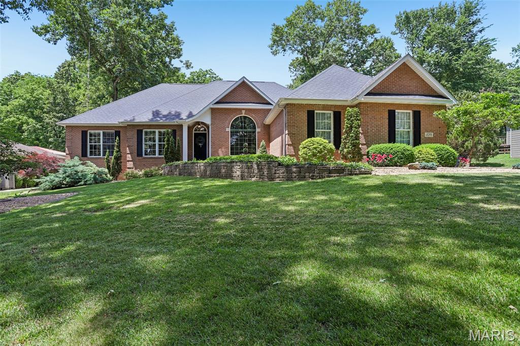 LAKE VIEW STUNNER!  This meticulously maintained 5 bed, 3 bath home has a gorgeous view of Lake Lou Yaeger and its own lake access lot around the corner.  The kitchen includes the appliances and has a walk-in pantry plus a dining area.  There's main level laundry, the primary suite containing a heated floor bathroom, and 2 bedrooms surrounding the large living room, bonus office area, formal dining room, and main level bath.  On the massive lower level you have two more bedrooms, another full bath, a bar for entertaining, and ample storage space.  The entertainment center, bar stools, air hockey table, and pool table stay, as well as some bedroom furnishings.  Enjoy the peaceful back patio in the fenced yard with lots of extra space for a garden including peach and apple trees.  Roof 2018, HVAC 2026, 20KW generator and so much more.  Call for your tour before this one is just a happy memory!