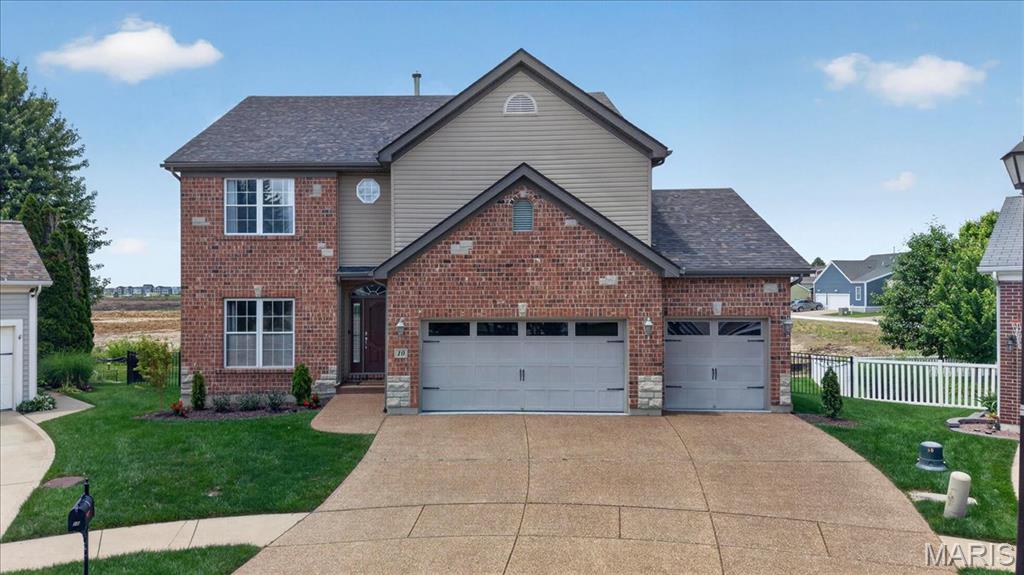 Welcome to this lovely 2-story home nestled in the heart of New Town at St. Charles. 
Amazing custom 3-bedroom/3-bathroom home with a 3-car garage. This outstanding home features gorgeous hickory hardwood flooring. The kitchen comes complete with 42" Custom white cabinets, quartz countertops, stainless-steel appliances, and a walk-in pantry. The family room features a 2-story gas-burning fireplace, crown molding, an 18-foot ceiling, and a wall of windows that gives the home a very airy feeling. Upstairs, you'll find a spacious loft area (which could be converted into a 4th bedroom). The large master bedroom suite boasts coffered ceilings, French doors, a separate tub and shower, double sinks, and two primary bedroom walk-in closets, including a 12' x 10' closet! Other home features include main-level & upper-level laundry rooms, dual HVAC system, 2 hot water heaters, 9' foundation pour, a walk-out basement, newer architecturally shingled roof! The backyard is fully fenced with black aluminum fencing!
 If you are looking for a vibrant community that offers waterways for kayaking and paddle boating, scenic canals, charming restaurants, local shopping, coffee houses, a wine bar, bar & grill, and even an ice cream shop. Residents enjoy incredible amenities, pickleball courts, sand volleyball courts, parks, playgrounds, an amphitheater for festival and wedding events, neighborhood gatherings, and a local farm that adds to the small-town charm..... This is the place for you!!
All of this is located just minutes from the highway, making it easy to enjoy both convenience and an amazing lifestyle. This is more than just a home — it’s a community where memories are made.
