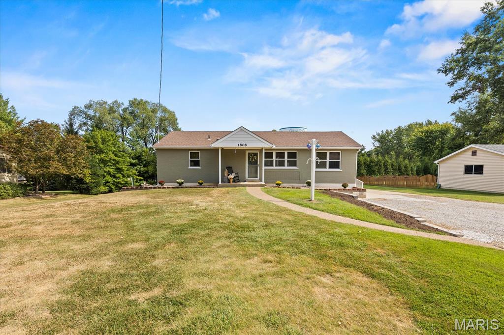 Charming all-brick home on nearly 0.5 acres with NO HOA! Perfect for first-time buyers or downsizers wanting space and independence. Features a massive open-concept layout with a large granite center island and a double-sized primary bedroom for ultimate comfort. Out back, enjoy a composite deck complete with an accessible ramp. Upgraded with Anderson 100 Series single-hung windows. Outdoor enthusiasts will love the detached 24x24 garage featuring a 16x7 door and side walk-in door. Don't miss this St. Peters gem!