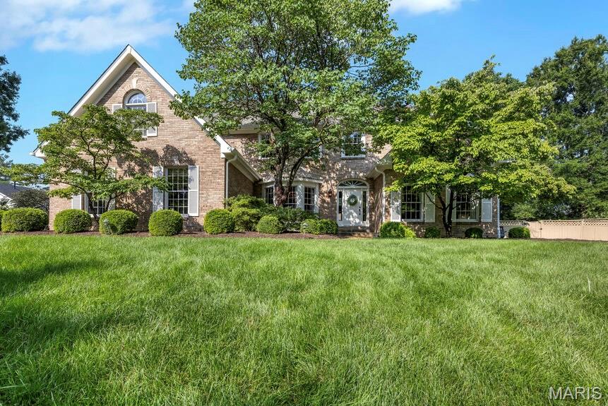 Premier location in one of Chesterfield's sought after neighborhoods, this completely custom, expanded 1.5 story home with gorgeous pool and beautifully landscaped yard, offers timeless craftsmanship, exquisite custom millwork throughout, and an incredible floorplan designed for everyday living and entertaining. A dramatic two-story great room with exposed beams welcomes you with floor-to-ceiling, Palladian windows, soaring fireplace and french doors leading to large, pergola-covered deck. The expansive chef’s kitchen is heart of home and showcases custom cabinetry, premium countertops, refined designer finishes, a premium suite of Dacor appliances, built-ins, and cozy fireplace. Just off the kitchen, the sunroom addition is an ideal place to relax with spectacular views of the private yard and inviting pool. Elegant dining room and living room feature stunning millwork, built-ins and provide perfect spaces for gathering and entertaining. The primary suite was substantially expanded and is exceptional retreat with two walk-in closets, with one being an impressive custom designed 23'x8' dressing room, and a spa-inspired, luxury bath with custom vanity, premium finishes. Even the large laundry boasts custom cabinetry and design. Upstairs, three generously sized bedrooms each feature walk-in closets. Two bedrooms share a Jack-and-Jill bath, while the third enjoys its own ensuite bath. A versatile bonus room with built-ins off one of the bedrooms provides the perfect space for a playroom, study area, craft room. The expansive finished lower level is designed for entertaining with a large recreation area featuring built-ins, an impressive bar, large game area, full bath, sleeping area, private office space, and custom storage room for outdoor enthusiasts. With a resort-style backyard and pool, this extraordinary custom home with luxurious finishes is just minutes from highway, shopping and dining. It truly has it all. New roof, new carpet throughout 2026.