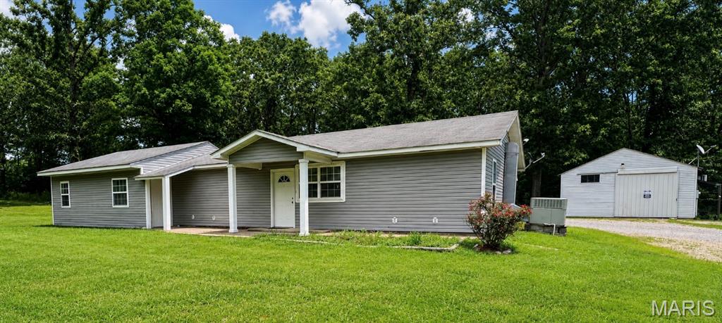 PRICE IMPROVEMENT!! Remarkable Home within 5 minutes of Doniphan! This 3,(possibly 4) bedroom, 2 bath home on 5 acres of land. the home has 2,064 sq ft of lining area. Open floor plan, large kitchen, living room, dining room and family room. one potential bedroom could be used as an office as well. Large utility room with separate walk-in pantry. Outside you will find a firepit and a large yard, with garden spot. Also included with the property is a large shop building, with electric, air conditioning and gas heat. There is an additional small metal storage building on the property. This home is move-in ready. Call today for your showing. OWNER WILL CONSIDER ALL REASONABLE OFFERS!