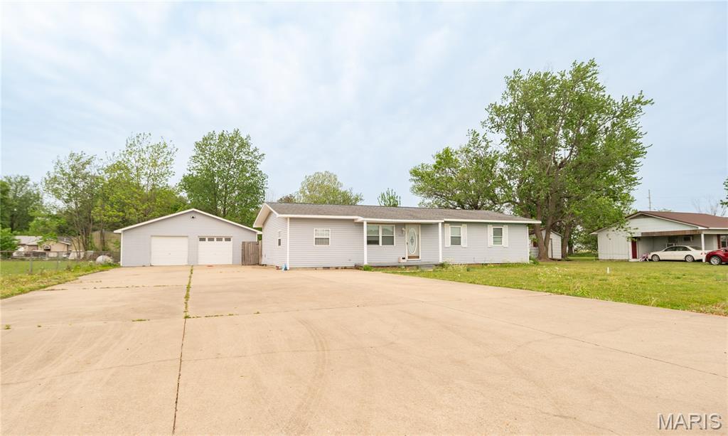 Charming 3 bed, 2 bath home on James Ward Dr. featuring a spacious, well-designed floor plan ideal for comfortable living and entertaining. Enjoy a large driveway with plenty of parking, plus a detached 2-car garage that doubles as a workshop - perfect for hobbies, storage, or projects. The fully fenced yard offers privacy and room to roam, complete with an above-ground pool for relaxing on warm days. Inside, natural light fills the living spaces, creating a bright and inviting atmosphere. Step outside and take in the beautiful agricultural views that provide a peaceful, country feel while still enjoying the convenience of a functional, move-in-ready home.