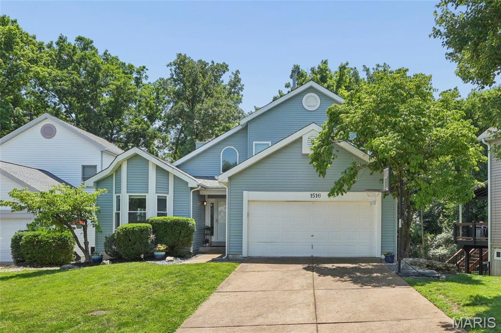 Welcome to this beautifully updated 4-bedroom, 3.5-bath home in the highly desirable Strawberry Ridge subdivision, ideally situated on a private-feeling cul-de-sac atop the ridge. Thoughtfully designed for modern living, this home offers the perfect blend of space, comfort, and connection to nature.

A light-filled two-story foyer opens to an inviting open floor plan ideal for everyday living and entertaining. The vaulted great room showcases abundant windows and a cozy wood-burning fireplace, creating a warm, welcoming space that flows seamlessly into the kitchen and dining area.

The kitchen is the heart of the home, featuring granite countertops, white shaker-style cabinetry, a breakfast bar, and newer appliances. A charming bay window fills the space with natural light, making it bright, airy, and perfect for both busy mornings and gatherings.

The main-floor primary suite offers a true retreat, highlighted by a bay window with built-in bench seating, serene wooded views, and added storage. The ensuite features a newly updated shower for a fresh, spa-like feel.

The finished walk-out lower level adds flexible living space with a fourth bedroom, full bath, rec room, and laundry, plus access to a covered patio/deck—great for year-round use.

Enjoy outdoor living on the spacious deck overlooking a wooded backyard, perfect for relaxing, play, or entertaining.

Move-in ready, this home includes major updates: new roof, siding, gutters, deck improvements, refreshed landscaping, energy-efficient windows, and HVAC (2023)—offering peace of mind for years to come.

Located in the top-rated Parkway School District with easy access to Hwy 44 and Big Bend Rd, this home delivers both convenience and a quiet neighborhood feel.

Beautifully updated, ideally located, and designed for modern living—this is the one you’ve been waiting for in Ballwin!