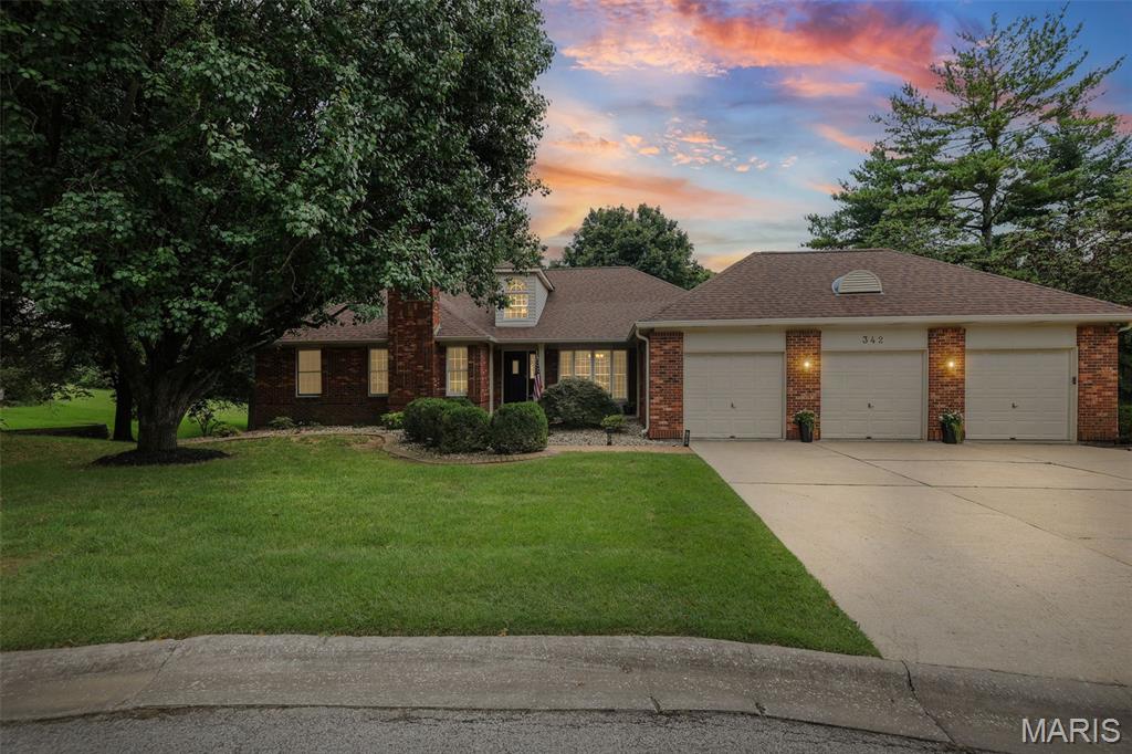 Located in the desirable Oak Hill Estates subdivision, this outstanding all-brick walkout ranch is the epitome of refined living space! This timeless, updated home offers fantastic, functional open flow with gleaming hardwood floors throughout. The spacious floor plan features high ceilings, multiple brick fireplaces, and tons of natural light! A two-story foyer welcomes you into the home and flows into the office, complete with French doors and a brick fireplace! The large, bright dining room continues into the living area with another brick fireplace and access to the deck. The updated kitchen is well-equipped and boasts multiple work surfaces, built-in double ovens, a large pantry with views directly into the main living spaces. The kitchen opens to the lovely fully screened-in porch for al-fresco dining and relaxing, and a deck overlooking the expansive, private yard. The large primary suite features a fantastic walk-in closet and an updated spa-like bathroom! Two additional bedrooms and a full bath complete the first floor.  A full walk-out basement expands the home's footprint, offering endless possibilities for recreation, media, and hobbies with direct access to the backyard. It also boasts a gas fireplace, a 4th bedroom and full bathroom, as well as two large storage areas. Find a convenient mud room off the three-car garage, which is such a bonus for all your gear!