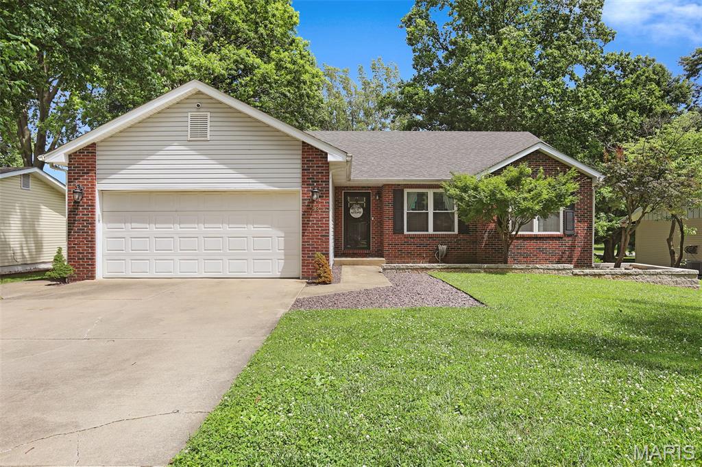 If you have been searching for the perfect balance of layout, space, updates, and location, this 4 bedroom ranch in the heart of Glen Carbon will feel like home. From the peaceful setting with mature trees and quiet street, you will instantly be at ease. Charming foyer leads to open concept living and dining filled with great natural light and the space to entertain. Living room is anchored by stone wood burning fireplace and beautiful hearth, vaulted ceilings and views of the peaceful backyard. The kitchen is the heart of the home with custom cabinetry, ample workspace, large center island, and additional counter space and open shelving added for beverage center and great storage. Breakfast nook is perfect for everyday and entertaining. Additionally, the main level features primary suite with hardwood floors, spa like bath with dual vanity, tub and shower, and walk in closet.  Two additional bedrooms with hardwood floors and full bath round out the main level. Lower level is spacious with large family room with egress window, bedroom, office, laundry room with full bath, and ample storage. Step outside to enjoy quiet mornings with coffee or bar-b-ques with water views from your porch and patio. Take a walk to the water to fish or just enjoy the view. Set in the heart of Glen Carbon close to shopping, schools, interstates, and restaurants, this is a must see. Schedule your private showing today.
