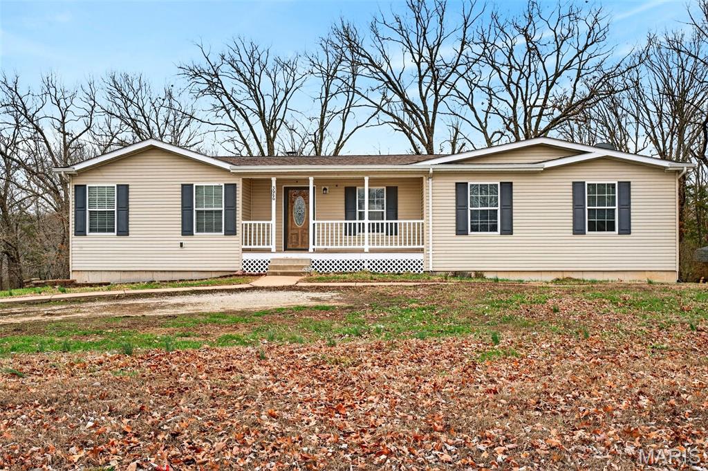 If you’ve been dreaming of owning your own private oasis away from the hustle and bustle of everyday life, look no further! Welcome to 3686 Highway Z in Hillsboro, MO. You’ll quickly fall in love with the easy living this home offers. The kitchen features custom cabinetry and a built-in entertainment area, making it perfect for hosting gatherings or enjoying quality time with family. Your spacious  primary suite is everything you’ve been looking for, complete with a luxurious en-suite bathroom featuring a walk-in shower, relaxing soaking tub, and a generous walk-in closet, the perfect place to unwind after a long day. The open and spacious kitchen offers ample prep space while allowing you to stay connected with family and guests, ideal for entertaining or keeping an eye on the kids while you cook.The full walk-out basement provides incredible potential, making it an ideal space for a 4th bedroom, family room, gaming area, and it is already stubbed in for an additional bathroom, giving you the opportunity to expand your living space exactly how you want.
Step outside and enjoy 3 beautiful acres with plenty of room to run, play, start a garden, raise chickens, or simply take in the peaceful surroundings. This property truly offers the tranquility of country living, giving you the chance to slow down and enjoy life.
All of this comes with convenient access to major highways, making commuting or running errands easy.
If you’ve been searching for a home that offers space, privacy, upgrades, and peaceful living, this is the one you’ve been waiting for. Schedule your showing today—this gem won’t last long!