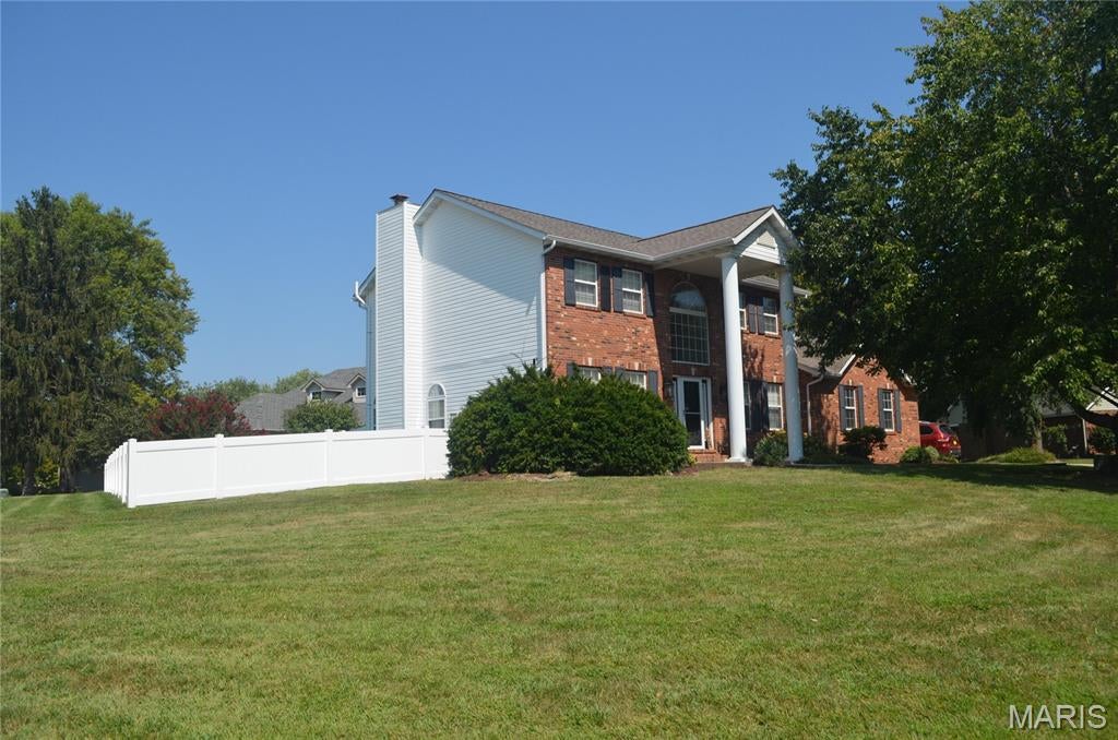 Welcome to 121 E Willow Bend Dr, a spacious home on approximately 0.56 acre in desirable Meadow Land Estates. With approximately 2,756 total interior sq. ft., including finished lower-level space, this 3-bedroom, 4-bath home features a gas fireplace, formal dining room, office, real hardwood floors, open kitchen/living area, granite countertops, abundant cabinetry, breakfast bar, main-floor laundry, and a security system. The primary suite includes vaulted ceilings, a large closet, dual vanities, soaking/jetted tub, and separate glass-enclosed shower. Two additional bedrooms provide plenty of sleeping areas. The finished lower level includes a large recreation/family room, flex space, half bath, and generous storage. Enjoy a large deck, private yard, side yard for garden beds, and a 3-car attached garage. Updates include roof (2017), water heater (2022), kitchen/flooring (2018), upper-level A/C (2021), and additional cosmetic updates throughout. Individuals are welcome.