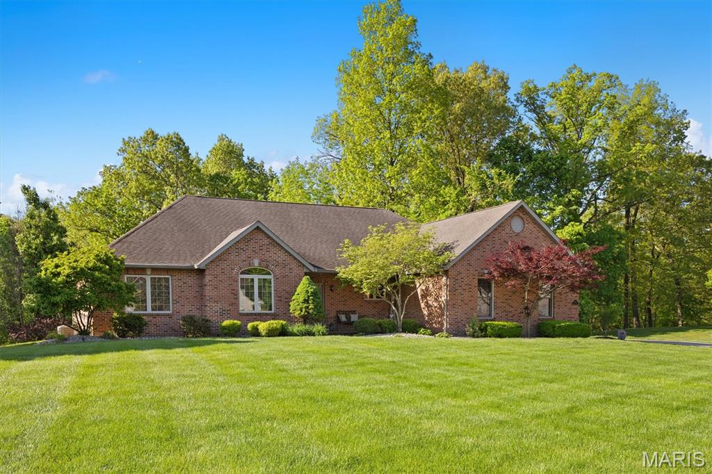 Welcome to 1845 Riviera, a beautifully designed executive home nestled on a serene 1.37-acre lot in one of O’Fallon’s most sought-after neighborhoods. This spacious 5-bedroom, 5-bathroom residence offers the perfect blend of luxury, comfort, and privacy—ideal for both family living and entertaining. Step inside to find an inviting open-concept layout filled with natural light, elegant finishes, and thoughtful design throughout. The gourmet kitchen features Viking high-end appliances, granite countertops, and a large island that flows seamlessly into the living and dining areas. The primary suite is a true retreat, complete with a spa-like ensuite bath and generous walk-in closet. Downstairs, a finished lower level offers additional living space, including a recreation area, home theater potential, or in-law accommodations. Outside, enjoy tranquil views from the expansive backyard, with plenty of room for a pool, outdoor kitchen, or garden oasis. Located in a quiet, established community with excellent schools, convenient access to Scott AFB, shopping, and dining—this home truly has it all. ALL information is deemed reliable but is not guaranteed and should be verified by the buyer and/or buyers agent before making an offer.