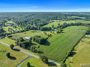 Approximately 33+/- acres of highly usable land, with the majority currently in tillable production and generating crop income. Whether you're looking to expand your farming operation, build your dream home, or invest in future development potential, this property offers exceptional versatility. Multiple private building sites throughout the acreage provide opportunities for a secluded country residence with scenic views. With approximately 280+/- feet of paved road frontage, the property also presents attractive subdivision and investment possibilities. Productive farmland, income potential, desirable road access, and future development opportunities make this a property worth considering. Land remains one of the most limited resources—don't miss the chance to own a valuable piece of it.