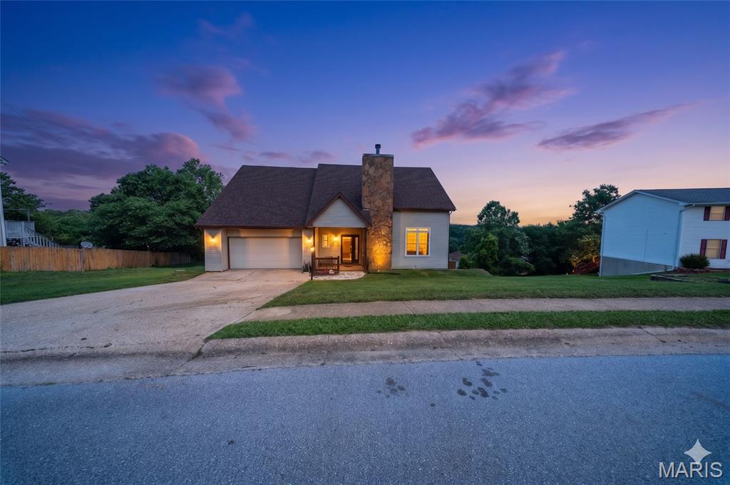 Welcome to this beautiful 1.5-story home in St. Robert offering 3 bedrooms, 2.5 bathrooms, and plenty of space for comfortable living. The inviting living room features exposed wood beams and a stunning stone fireplace that creates a warm focal point for the home. The main level also includes a formal dining room, a well-appointed kitchen with tile backsplash and soft-close drawers, sleek stainless steel appliances, and a convenient half bath for guests. Upstairs, you'll find all three bedrooms and two full bathrooms, providing a functional layout for families or guests. The primary suite offers a full ensuite bathroom and a walk-in closet. The walkout basement expands your living space with a spacious family room and laundry area, while an unfinished storage room offers plenty of space for seasonal items, tools, or future expansion possibilities. Step outside to enjoy the fenced backyard, perfect for pets, play, relaxing around the fire pit, or entertaining. Combining character, functionality, and a desirable location, this home is ready for its next owners to make it their own. Schedule your private tour today!
