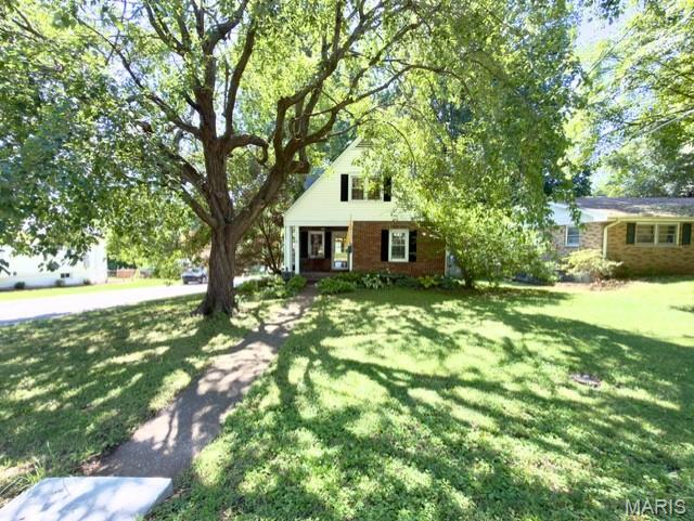 Welcome to this charming 1.5-story home in the heart of Florissant, offering a warm blend of character and thoughtful updates. Step inside to a bright living room/dinning combo with wood floors and a decorative fireplace, flowing into a cozy family room for extra gathering space. The kitchen features natural lighting and wood flooring, perfect for everyday meals or hosting. A main-floor bedroom and full bath add convenience, while two additional bedrooms and a second full bath upstairs provide comfortable privacy. The partially finished, walk-out lower level offers storage, laundry, and room to expand. Situated on a level corner lot with a detached 2-car garage, and a spacious, mixed wood and brick-expanded backyard deck that is perfect for entertaining on those summer nights. This home combines charm, function, and location — all just moments from Old Town Florissant, parks, and local favorites.