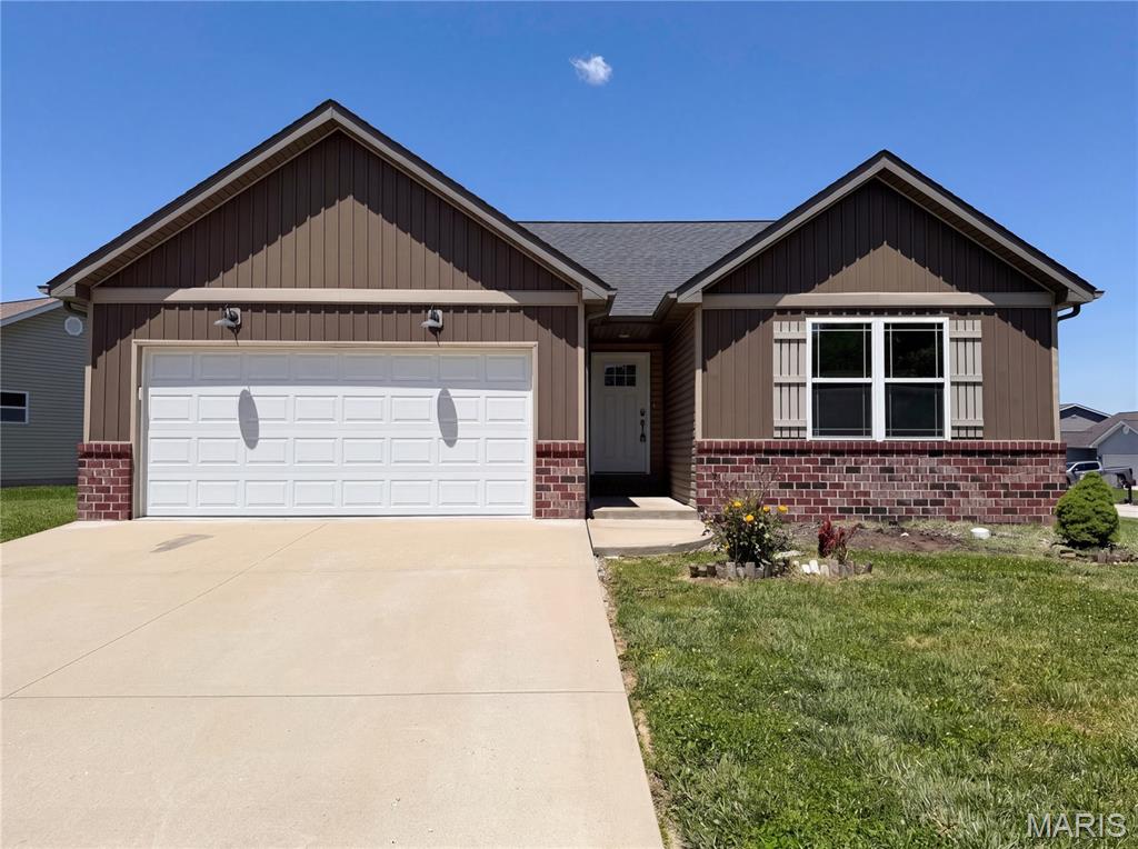 Don't miss 7932 Laurel Flats Dr, updated with fresh paint and partial flooring. A fireplace anchors the main living space. The kitchen includes an island and all stainless steel appliances. The primary suite features a walk in closet and double sinks in its bathroom. An exterior patio extends outdoor utility. This updated property combines comfort and everyday functionality. Included 100-Day Home Warranty with buyer activation