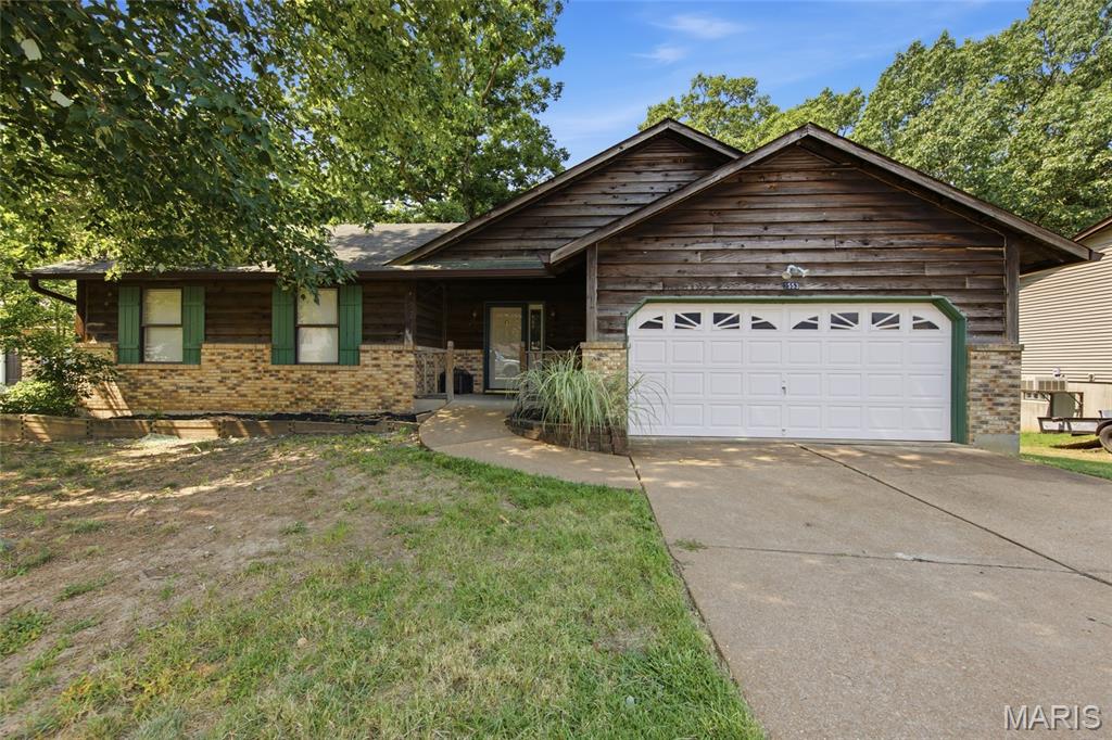 Welcome home to 2553 Tricia Ln in High Ridge! This charming 3 bedroom, 2.5 bathroom home combines classic curb appeal with a functional, comfortable layout throughout. The exterior showcases beautiful brick veneer and cedar siding, offering timeless charm from the moment you arrive.

Step inside to a spacious living room featuring a vaulted ceiling and cozy fireplace, creating a warm and inviting space to gather. The well-appointed eat-in kitchen offers ample cabinet storage, a pantry, and a dining area, complemented by charming wood beams on the ceiling and a door leading out to the generously sized deck — perfect for entertaining or simply enjoying the outdoors.

Also on the main level, you'll find the primary bedroom suite complete with an attached bath, along with two additional bedrooms and a full hall bathroom.

The walk-out lower level expands your living space even further, featuring a spacious rec area ideal for entertaining or relaxing, a convenient laundry area, a half bath, and a versatile office that's perfect for remote work or a quiet study space.

With its thoughtful layout, inviting living spaces, and desirable walk-out lower level, this High Ridge home is ready to welcome its next owners. Schedule your showing today!