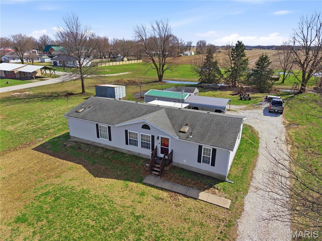 Enjoy easy living in this spacious 4 bedroom (1 non-conforming), 2 bathroom manufactured home situated on almost Â½ an acre in Cairo! This home offers a comfortable layout with great natural light throughout, including skylights that brighten the living spaces.
Step inside to find fresh updates including new flooring, fresh paint, and a newer dishwasher. The layout flows nicely from the living room into the formal dining area, continuing into the galley kitchen (all appliances stay) and additional eat-in kitchen space, providing plenty of room for everyday living and entertaining. Outside, you'll appreciate the extra space with a 15x24 shop building featuring concrete flooring and electric, plus a carport and two additional sheds! (Hello Extra Storage!)
If you're looking for comfortable main-level living in Cairo, this property checks the boxes!