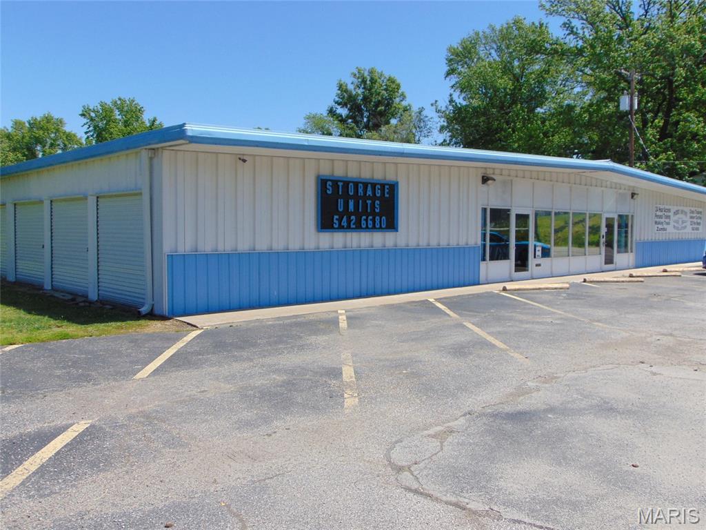 This is a large steel constructed building built in 1968 that is approximately 7680 square feet per county records It has a 5800 square feet open area that is a key card accessible that is currently a health/fitness facility. The fitness area has three bathrooms, one of which includes a shower. There is a three phase electrical system to power all the electrical needs of the building and all utilities are in place. The building is currently fully functional and includes four storage units with office space. This building has plenty of potential for commercial needs and is available when you are ready. The gym equipment is not included in the sale of this property.