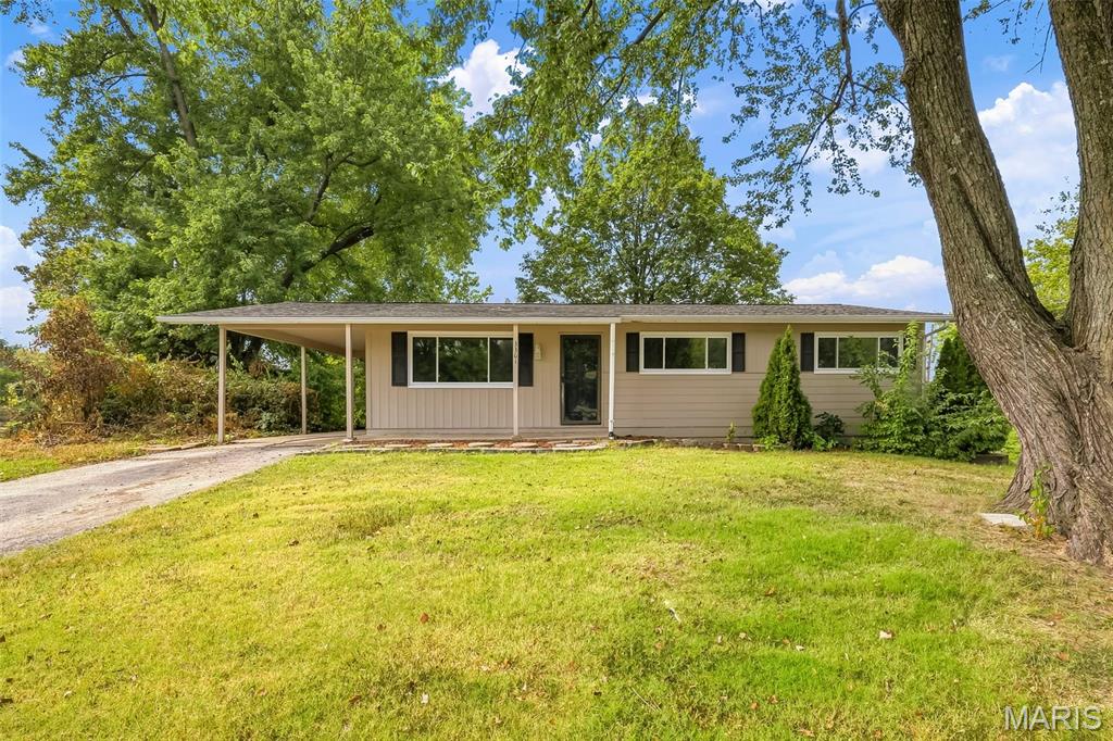 3 bedroom, 1 bath home in an excellent St. Charles location!  There is easy access to shopping, services, recreation, restaurants, everyday conveniences and Highways 70-370-94/364.  This home sits on a .33 Acre lot that has mature trees sprinkled throughout the back yard.  The floorplan is open and inviting with beautiful hardwood flooring throughout most of the home.  Features include a Living Room with a large front window, breakfast/dining area, wood cabinets, stainless steel appliances, smooth top stove, dishwasher, range hood, tile backsplash, spacious Family Room, glass block window in the bathroom for natural light, built in bookcases in the dining area, 1 car carport, a storm door and more.  The lower level has approx. 482 sq ft of partial finish and plenty of unfinished storage space.  There is a fireplace in the Family Room that is not operable and has not worked or been used during their home ownership (as is).  Since their ownership, the sellers have made the following improvements: all windows replaced in 2023 (except the bathroom), replaced electric panel in 2024, refinished the hardwood and replaced the basement sliding glass door.  There is a door in the Family Room that is sealed and inoperable.   Lambert International is a short commute and historic downtown St. Charles as well as the Streets of St. Charles Entertainment District are close by.  Numerous amazing parks are a short distance away.  Check it out!