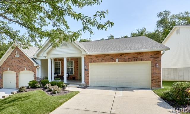 Immaculately designed former display villa with long list of upgrades. Open floor plan. Freshly painted interior. Energy efficient 2 BRs + 1 Study with 3 full baths. Large front porch. Vaulted ceiling throughout main floor.  Upgraded pergo flooring in foyer, study, dining room, great room, breakfast area and kitchen. White 6-panel doors and case moldings.  Floor-to-ceiling built-in bookcase in study.  Ceiling fans.  Gas luxury fireplace with nook. Upgraded 42-inch kitchen cabinets.  Open kitchen with breakfast area.  Master suite includes large walk-in closet and shower with seat.  Main floor laundry.  Wrought iron spindles and open stairs.  Finished lower level with high foundation and a wall of windows.  Built-in surround sound system.  Square footage in county records does not include the finished lower level. Lawn sprinkler system and maintenance, snow removal, trash pick-up, and roof and exterior maintenance/repairs covered by Community Association Fee. Location: End Unit