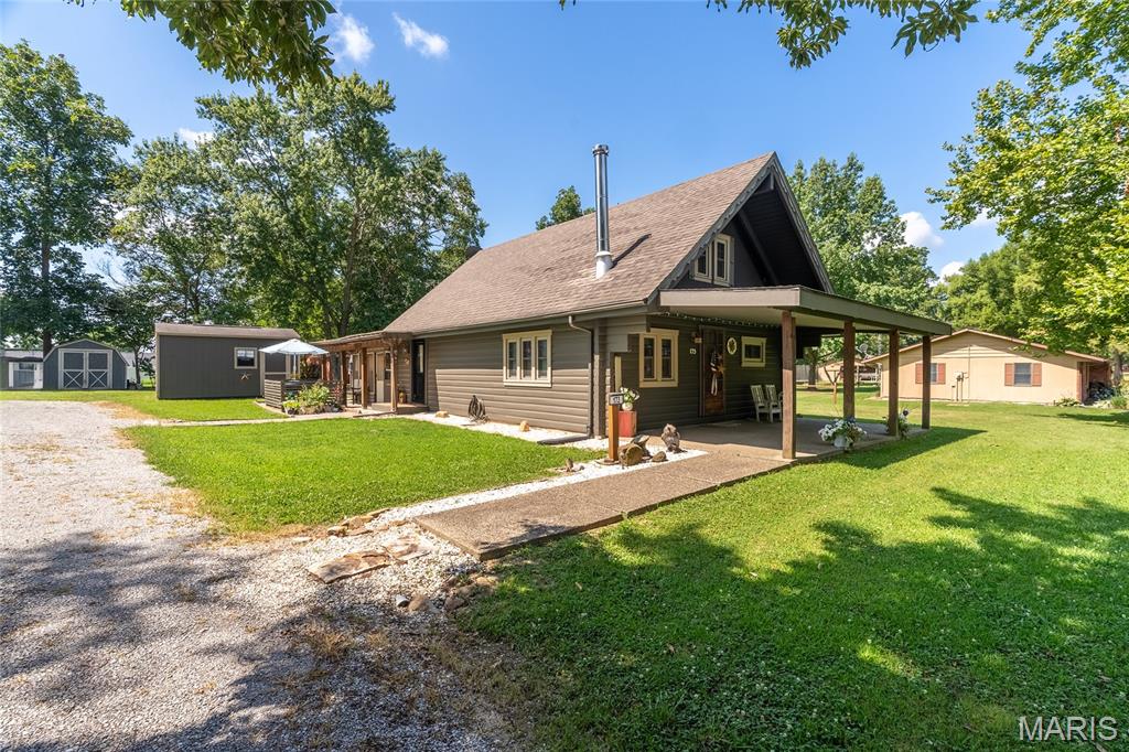 This inviting log cabin offers a warm, rustic atmosphere with a functional multi-level layout designed for comfort and flexibility. The main floor features an open living area with vaulted celings centered around a wood-burning stove, creating a cozy focal point for the home. A loft bedroom overlooks the main living space, adding character and additional sleeping or relaxation options.

The fully finished basement provides valuable extra square footage, including space that can serve as a possible third bedroom, home office, or hobby area. Whether used for guests, work, or recreation, the lower level adds unique versatility to the home.

Set in a peaceful rural location, this property blends the charm of cabin living with everyday practicality. A great opportunity for anyone seeking a unique home with warmth, space, and room to tailor to their needs.