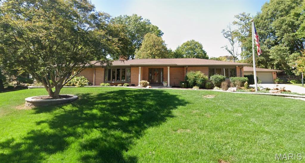 Move right into this sprawling custom ranch on private Ednick Drive in Swansea, IL. This 4 bedroom/ 4 bath home sits on .62 acres and is completely renovated. Welcoming entry foyer boasts brand new luxury vinyl plank flooring that flows throughout. The large Living/Dining room features a stone fireplace with gas insert and a beautiful bay window. The Hearth room also features a stone fireplace, a full wall of built-ins and a full wall of windows and doors that overlook the pool. The gourmet Kitchen includes high-end Kitchenaid refrigerator and dishwasher with custom panels and built-in double ovens and gas cooktop that are black stainless, multi tiered custom cabinets, granite countertops, glass tile backsplash and a breakfast bar. The nearby Breakfast area is flooded with natural light and perfect for morning coffee overlooking the private backyard. The Primary Bedroom wing includes the main Bedroom with a 15x10 walk-in closet housing custom built-ins, and a plush bathroom with dual vanity, walk-in shower and a whirlpool tub. Convenient to the main bedroom is a 2nd bedroom/currently an office, with built-ins included. 2 additional Bedrooms are located in the other wing of the house, both featuring an ensuite bath with walk-in shower and floating vanity with corian top. The laundry room is equipped with washer/dryer, cabinetry and a utility sink. The huge Family room is perfect for watching movies. The Pool house/rec room features a 10x10 kitchen with GE Profile stainless refrigerator, dishwasher and microwave, a nearby bathroom and full wall of windows including a patio door that opens to the outdoor patio. The backyard is perfect for your staycation featuring an extra large patio surrounding the  inground, salt water swimming pool. The totally fenced backyard includes lush landscaping, a full sprinkler system, natural gas run to the tiki torches and bbq grill, custom lighting and a storage shed. New Roof-2026.