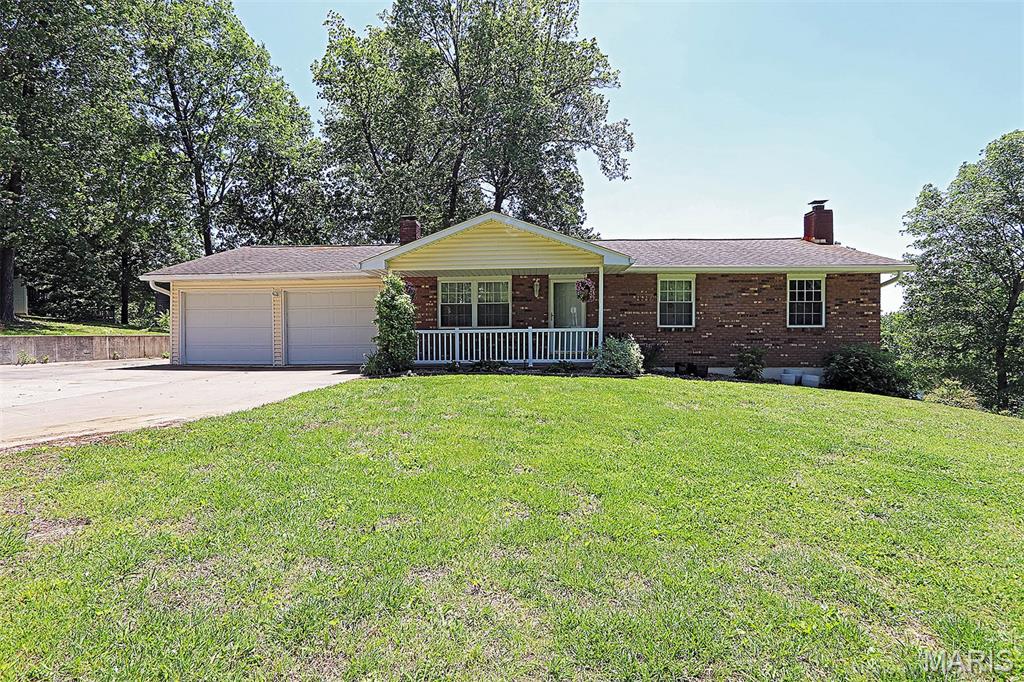Country life in city!!  Across from Bent Creek golf course.  Vinyl plank flooring throughout.  Gutter guard system.  Huge patio with water view.  33x10 covered back porch.  Fireplace in LR.  Woodstove in basement.  New 14x14 stick built storage shed.