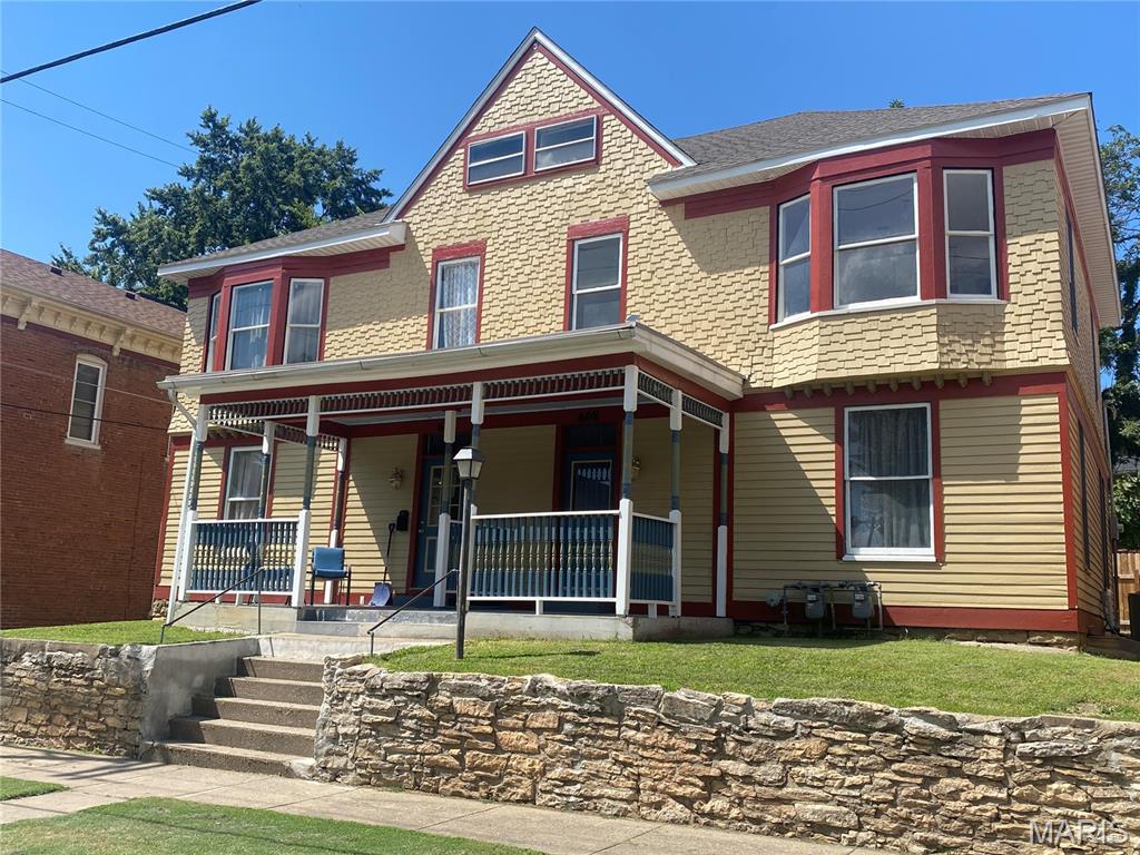 Here’s an investment opportunity with a head start! This beautifully refinished Craftsman duplex in downtown Hannibal offers two spacious units, each designed with 3 bedrooms and 1.5 bathrooms. Major improvements have already been taken care of, including a complete rewire of the entire building, separate new HVAC systems and water heaters for each unit, and a new roof in 2023. The exterior has also been completely refinished, bringing fresh life to the home’s classic Craftsman character. One unit is fully completed and currently occupied by a tenant paying $1,100 per month, with the tenant responsible for utilities. The second unit offers an opportunity to finish the space to your liking and has already been completely sheet rocked. Even better, many of the materials needed to complete it are included with the sale, including kitchen cabinets, light fixtures, toilets, and additional finishing items. Both units have laundry hookups in the basement as well as dedicated attic storage. Out back, a fenced patio provides additional outdoor space for tenants to enjoy. With one side already producing income, many of the big-ticket improvements completed, and much of the groundwork done on the second unit, this property offers an excellent opportunity to complete the renovation and unlock the full potential of this downtown Hannibal duplex.