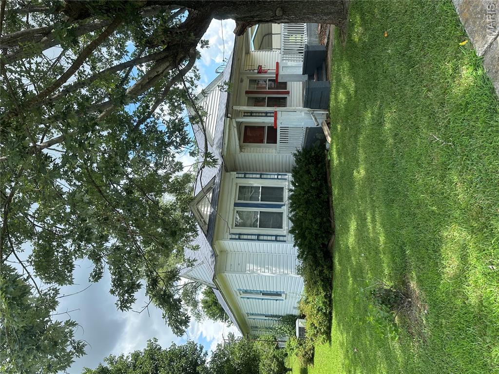 Just the right size! Cute 2 bedroom, with dining room, and utility room. Has vinyl siding and replacement windows, newer water heater, and up-to-date heat and air.  Carport, shed, cellar, and fencing.  Some hardwood, oven/range, refrigerator, washer/dryer are part of the package.  This has been a happy home for the family for many years, but it's time to move on.  Call today to see.