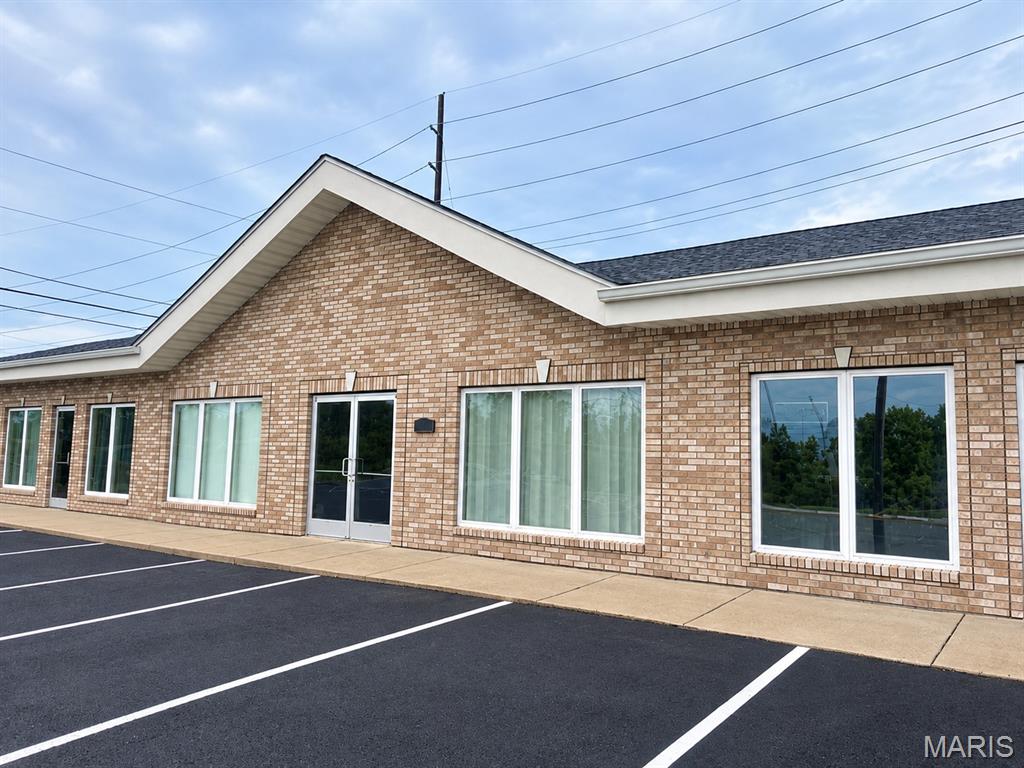 Discover an excellent opportunity with high visibility and traffic in the heart of Troy, MO. This well-maintained 1,800 sq ft commercial space is ideally situated with prominent Hwy 47 road frontage, boasting approximately 7,000 vehicles passing daily.  Updated interior with a fresh, new feel.  Two large, well lit front rooms perfect for retail or office use.  In the rear are two office spaces, storage closets, a break room, and restroom.  Suitable for office space, medical, or retail operations.  This space offers the perfect blend of visibility and functionality for your business needs. Agent Owned Property