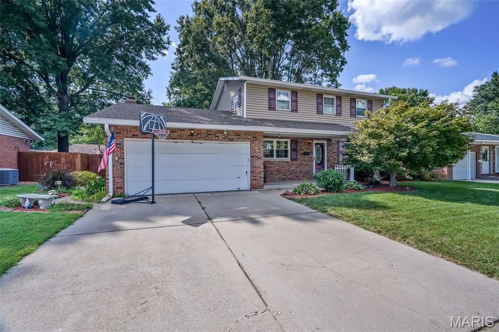 Welcome home to this spacious 4 bedroom, 2.5 bath split-level offering plenty of room to spread out and enjoy! Brand-new flooring and carpet throughout the entire home in 2026 give the interior a fresh, updated feel.

The home features two separate living areas, including one with a cozy fireplace, providing flexible spaces for relaxing, entertaining, or gathering with family and friends. The kitchen is equipped with double ovens, while the separate dining room offers a dedicated space for meals and special occasions.

Generously sized bedrooms provide plenty of comfortable living space, including a primary suite with a private en-suite bath. The spacious basement adds even more versatility along with plenty of storage space.

Outside, enjoy a fully fenced backyard with a wooden privacy fence, creating a private space for pets, entertaining, or simply relaxing outdoors.

With spacious rooms, multiple living areas, fresh flooring throughout, and a functional layout, this home offers the space and flexibility you've been looking for. Schedule your private showing today!

Buyer to independently verify all MLS information, including but not limited to square footage, room measurements, lot size, taxes, and school district.