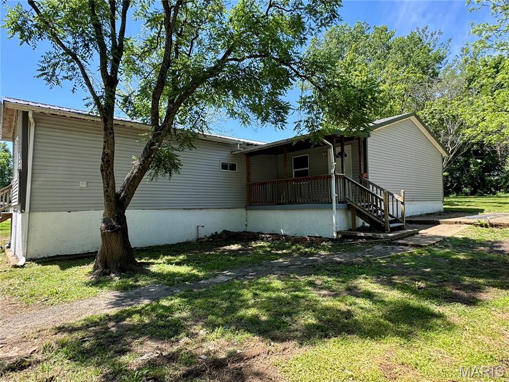 Super cute move in ready home. This is a manufactured home that has been added onto, but you would never know it. Large kitchen with stainless steel appliances. 3 bedrooms. Large utility room that could also be used as an office. The front of the house has a nice covered porch and the back has a nice deck.  Private backyard.