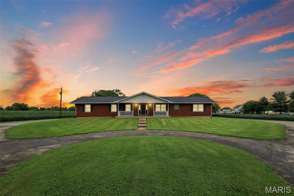 Great opportunity for a small development, or divide into small farm type tracts with 2 acres or just enjoy the use of the 12 acres for additional privacy & farm income. This borders to the west of Fairfield Subdivision and has public sewers located on property located just outside the Northwest corner of the 12 acres. There is also a lift station located in Fairfield on the west side of Fairfield Drive.  City water is next to the city road on the Southeast Corner.  The public road is concrete for approximately 100 ft where it turns to tar & chip.  The home is a full brick ranch on a flat building site with an oversized rear entry 2 car garage 26X28. Some updates include bamboo wood floor in living room.  All bedrooms have hardwood floors, on demand HWH, kitchen remodel in 2010, the outbuilding in rear was built in 1970 and is approximately 74X74 has a concrete floor, oversized garage door for SUV storage.  Hot tub is negotiable.  All information is deemed reliable but not guaranteed.  Buyers to verify all information with municipality. Previous contract to purchase fell through at no fault of the seller.