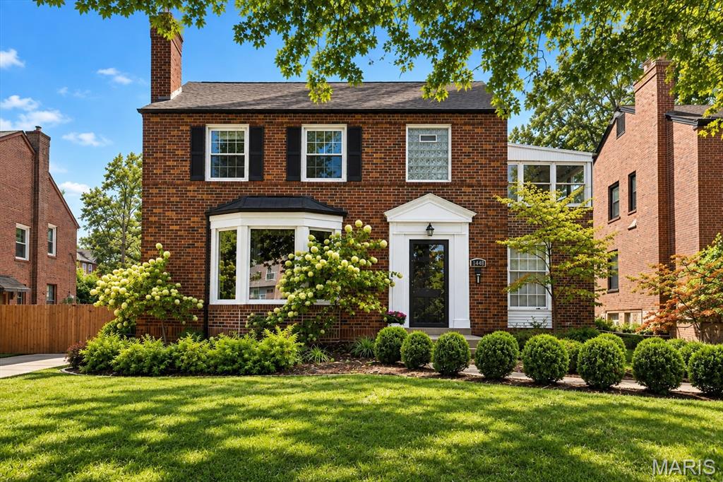 Classic University City charm meets stylish, updated living at 7448 Tulane! Nestled in the desirable University Place neighborhood and just moments from Mooney Park, this handsome two-story brick home offers wonderful curb appeal and a floor plan designed for today's lifestyle.  Beautiful hardwood floors flow through the main living areas, while the large updated kitchen opens seamlessly to the dining area, creating a bright, welcoming space for both everyday living and entertaining.  Upstairs you'll find three bedrooms, an updated full bath, and a nice bonus room - the perfect spot for a playroom, home office, reading retreat, or whatever suits your lifestyle. The recently finished lower level with new waterproofing and sump pump provides even more living space with a comfortable recreation room and convenient half bath.  Step outside to discover a spacious fenced backyard with irrigation system, offering plenty of room to garden, entertain, play or simply relax. A one-car rear entry garage adds to the home's appeal.  With its timeless brick exterior, thoughtful updates, and fantastic location near Mooney Park, this is a home you wont want to miss!!!!