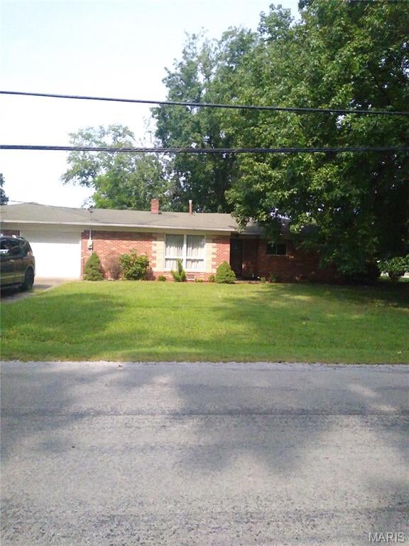 Looking for an updated, freshly painted home in Willisville? This 1958 brick home is waiting for its new owner. It has new windows, wood flooring in the bedrooms, new flooring in the kitchen and hallway, new carpeting in the living room and formal dining room, main floor laundry, new storm doors, 3 yr. old water heater, electric Lennox furnace, Air conditioner is 4 yrs. old, attic fan, 2 car garage and a shed in back that also has a garage door. The front entrance has a large coat closet and storage area.  Come see the beautiful metal backsplash in the kitchen. The appliances, furnishings, window treatments, and decor are all included in this listing. When you schedule your appointment you will see what awaits you.