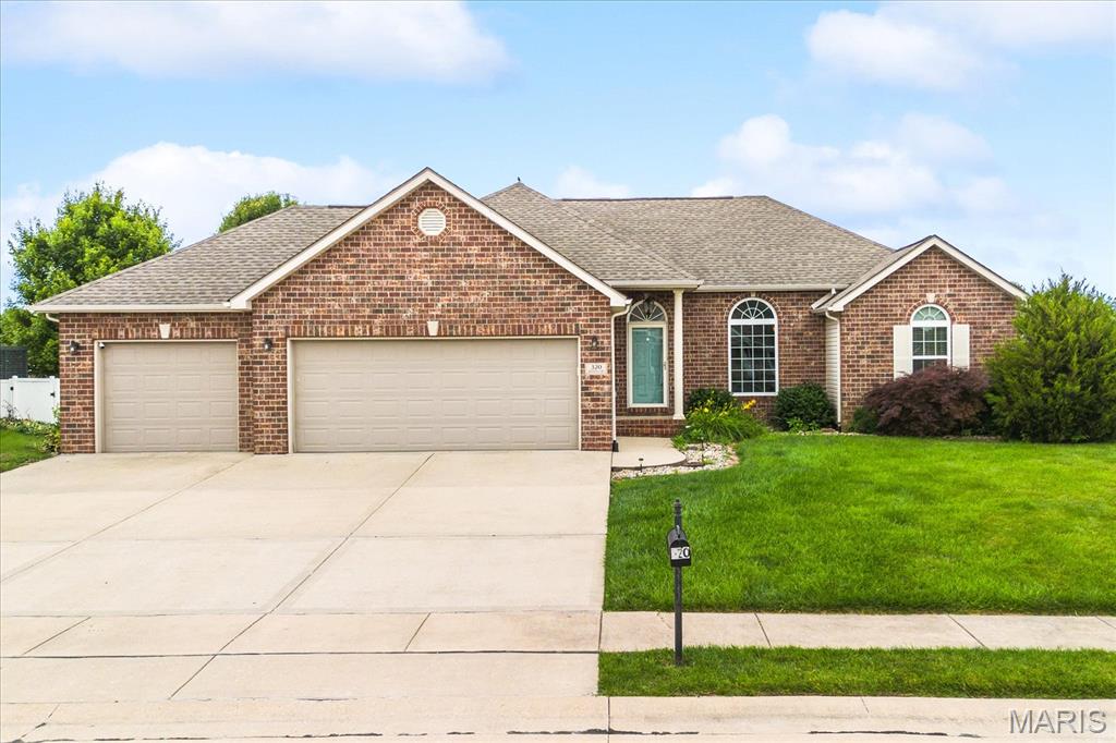 Welcome home to this beautifully maintained ranch in the highly sought-after Edwardsville School District! Offering over 3,200 square feet of finished living space, this home combines comfortable everyday living with exceptional space for entertaining. Step inside to discover a bright, open floor plan featuring soaring vaulted ceilings, fresh paint throughout the main level, and brand-new luxury vinyl plank flooring in the main living areas. The spacious great room is highlighted by a stunning floor-to-ceiling stone fireplace and flows seamlessly into the dining area and kitchen. The kitchen features granite countertops, abundant cabinetry, stainless steel appliances, a center island, breakfast bar seating, and a convenient pantry. The generous primary suite offers a tray ceiling, large walk-in closet, and an ensuite bath complete with dual vanities, whirlpool tub, and separate shower. The finished lower level significantly expands the living space with a large family and recreation area, wet bar, office or flex room, additional bedroom, and full bath perfect for guests, entertaining, or multi-generational living. Outside, enjoy the privacy of the fully fenced backyard and spacious patio, ideal for relaxing or hosting gatherings. Additional features include a 3-car garage, mature landscaping, and an attractive brick exterior. Conveniently located near schools, shopping, dining, parks, and interstate access, this move-in ready home offers the perfect combination of space, style, and location. Before making an offer on any property, buyer should independently verify all MLS data derived from various sources and not warranted accurate.