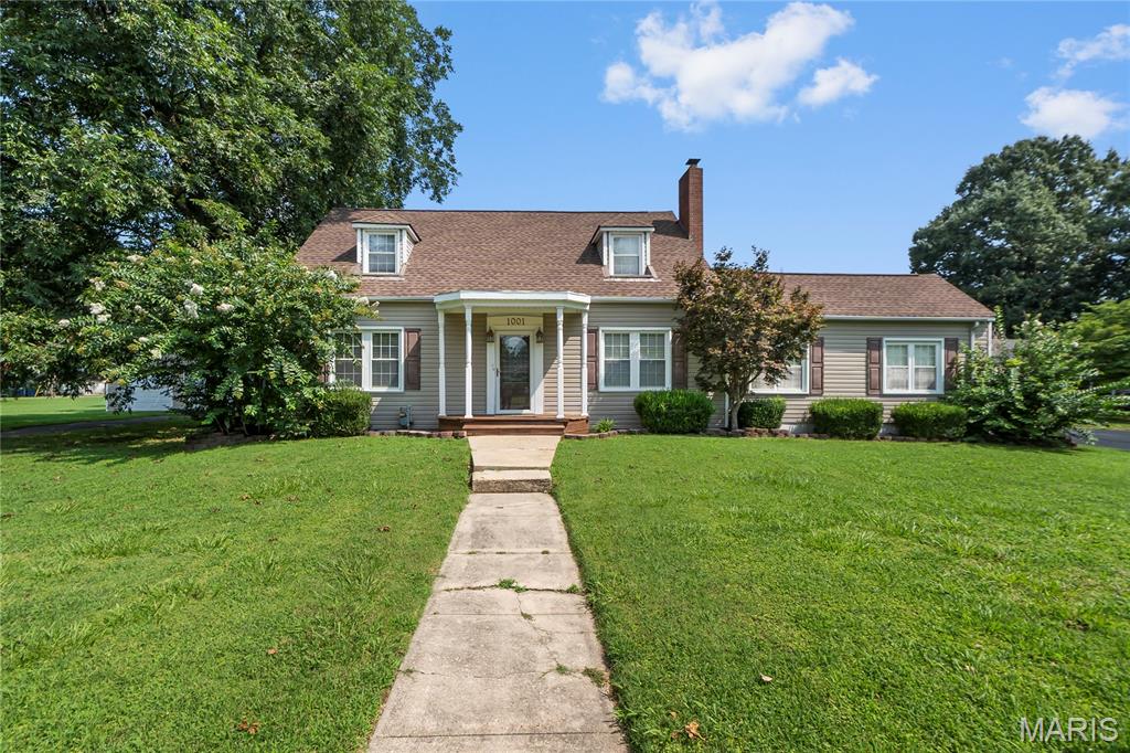 Welcome to this 5-bedroom, 3-bath home offering approximately 3,010 square feet of living space on three city lots in the heart of New Madrid. Rich in character and classic architectural details, this impressive 1&1/2 story home combines timeless charm with the space and functionality today's buyers are looking for.

From the inviting front porch and distinctive dormers to the spacious interior, this home offers generously sized living areas, large bedrooms, abundant natural light, and the craftsmanship that sets historic homes apart. Whether you're hosting family gatherings or simply enjoying everyday living, you'll appreciate the home's comfortable layout and exceptional amount of space.

Outside, the property continues to impress with an attached 612-square-foot carport, a 24' x 30' detached garage (720 square feet) built in 2013, a detached utility building, mature trees, and plenty of yard space across three lots. The detached garage provides excellent storage, workshop space, or additional parking.

If you've been searching for a home with character, space, and curb appeal, this is a rare opportunity to own one of New Madrid's classic residences.

Property Features
Approximately 3,010 sq. ft. of living space
5 Bedrooms | 3 Full Bathrooms
Situated on three city lots
Attached 612 sq. ft. carport
24'x30' detached garage (720 sq. ft.)
Detached utility/storage building
Mature trees and established neighborhood