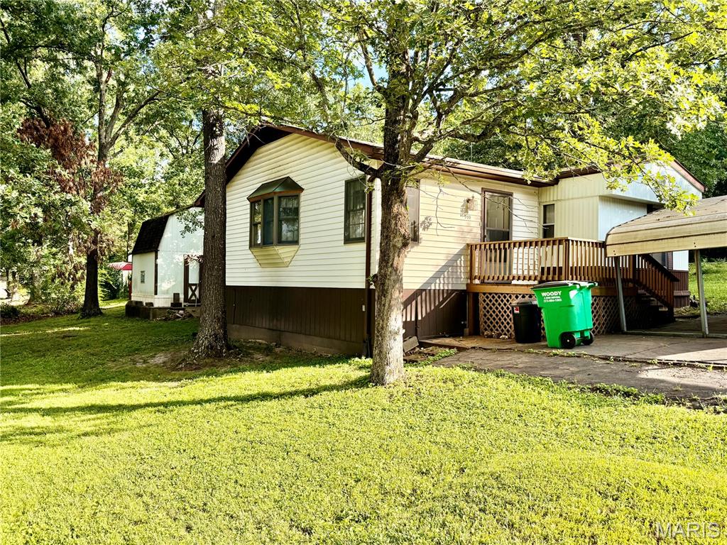 Why rent when you can own this charming 2 bedroom, 2 bath home with large addition on corner lot? Move in ready!! All kitchen appliances to stay (range, dishwasher, refrigerator, washer, & dryer) Most furniture will stay with the home. Large storage shed. Spacious deck. Carport. Terre Du Lac amenities for owners.