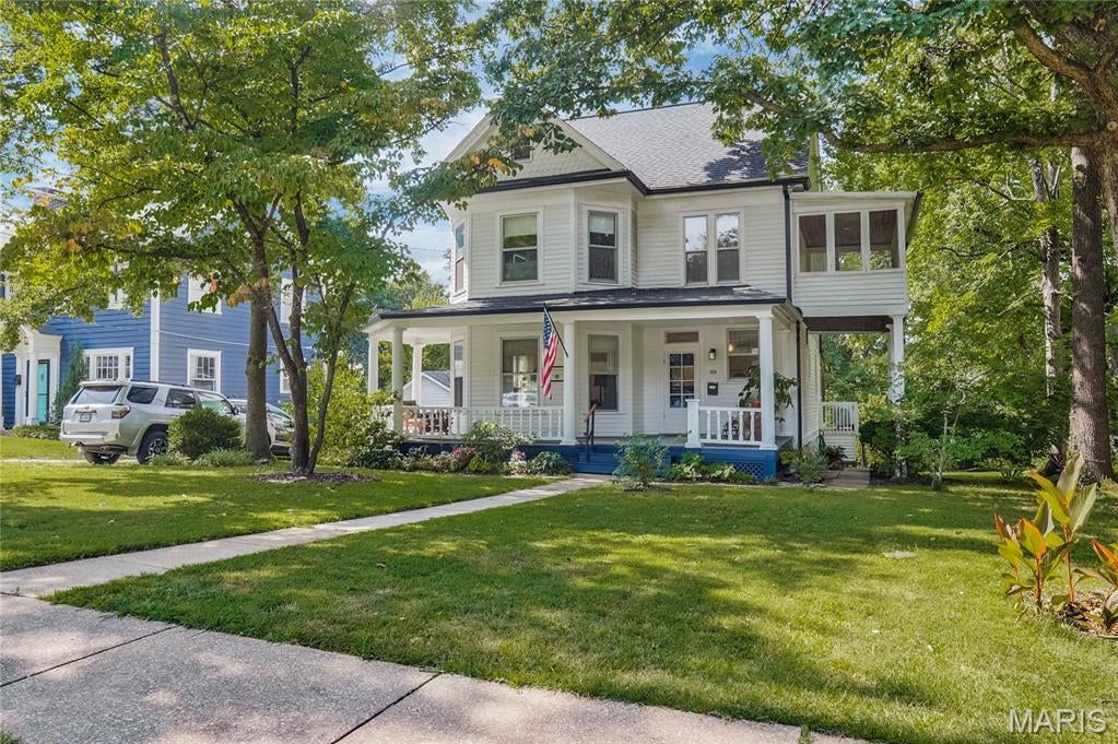 This Century Home has heritage and is understated elegant with a fun and harmonious floorplan.
The wrap around front porch has Tuscan columns, turned balusters and a scalloped wood trim pediment.  
As you enter the foyer, please notice the fine millwork which showcases some of the detailed craftsmanship that is original to the property.
The living and dining have bay windows with non-functioning fireplaces.
The tasteful interior paint is fresh and bright in neutral shades which on sunny days or not, accentuate the abundant natural light throughout. 
The eat in kitchen with laundry has an added design feature of connecting to a multi-purpose 11 x 15 covered screen deck and a park-like view.
Flooring is complementary luxury plank as well as in the powder and hallways. Oak floors in foyer,living and dining.
Upstairs on the second floor are four bedrooms with their original doors and transom windows. Primary bedroom has large front bay window . 
Two of the smaller bedrooms have large closets as well.
The main and second floor ceiling heights are nine feet.
Upstairs, be sure to check out the "sleeping porch", hallmark of a bygone era that's still relaxing and fun today.
Third floor has recreation room and large walk-in  hidden alcove for seasonal storage, pine plank floors and seven foot ceilings.
RECENT IMPROVEMENTS: 
New roof includes 6" gutters and guards (2022)
Furnace, a/c and water heater (2017) 
Both chimneys underwent extensive restoration (2025)  
New interior paint on first and second level (2024-26) 
Exterior lap siding and trim repainted  (2026)
All appliances stay, recent refrigerator, new dishwasher.
New basement laundry hookup connections, dual washtub w/faucet, commode in basement paired with a walk-in dog shower!
A comfortable, well maintained story book home with a workable floorplan and plenty of room to grow into.
Live local in a great neighborhood, the Marshall Place Historic District that's only moments away from the hub of Old Webster fine dining, shopping, schools and public library.
Simple access to highways or Clayton.