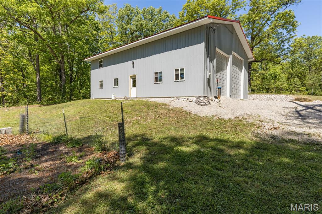 Privacy and your very own Barndominium! This is a great time to make this one your very own. This great 36'x50' metal building was recently finished off to make it home/shop all in one! Spray foam insulation- finished living space= come on in and check it out! Open to over 880 sq ft of garage space with 16ft side walls a 12'x10 garage door and a 14'x12' door- lots of room for vehicles and toys! Open to the living space- concrete floors- large living and dining space- large kitchen with lots of cabinetry- counter tops are on the way and will be completed soon! Main floor laundry is in the large full bathroom. Upstairs hosts 3 nice sized bedrooms finsihed with LVP flooring. So much to see here and more to make your very own- don't miss this one!