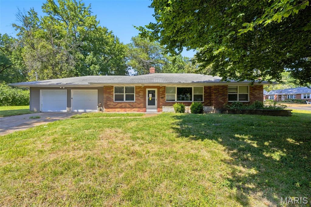 Welcome home to this inviting 3-bedroom, 1.5-bath property offering approximately 1,260 square feet of comfortable living space. The functional floor plan features welcoming living areas and a formal dining room perfect for everyday meals or entertaining. A 2-car garage provides convenient parking and additional storage. With plenty of space to relax and make your own with a little TLC, this home is ready for its next owner. Schedule your showing today! One or more photos may have been virtually staged.