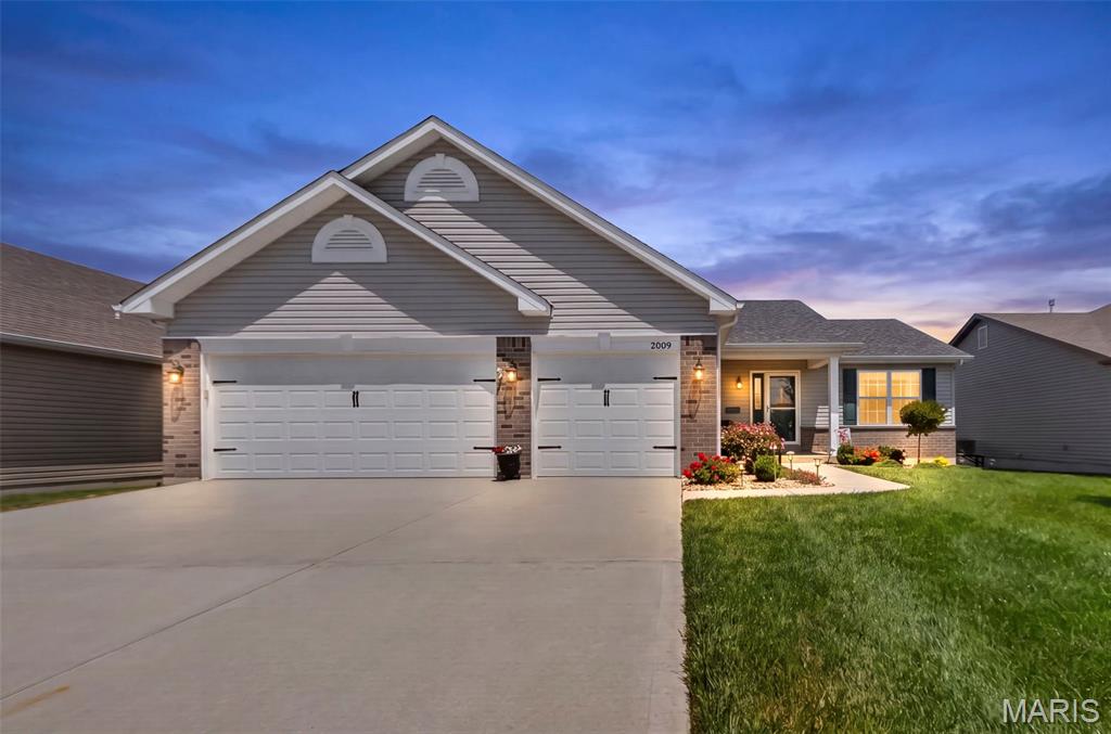 Welcome to 2009 White Branch Dr in charming St. Paul—a thoughtfully designed ranch home, equipped w/ handicap-accessible upgrades that blends modern finishes with everyday functionality. This 3-bedroom, 2-bath home offers effortless main-level living with durable luxury vinyl plank flooring flowing seamlessly throughout. The heart of the home is the beautifully appointed kitchen, featuring sleek quartz countertops and a matching backsplash, stainless steel appliances, under-cabinet lighting, upgraded pull out drawers in many cabinets and an oversized center island—perfect for entertaining or casual dining. A spacious walk-in pantry provides ample storage, while recessed lighting and a vaulted ceiling enhance the open, airy feel of the main living space. The primary suite is a true retreat, complete with a large walk-in closet outfitted with custom shelving for optimal organization. Convenience continues with a main floor laundry room featuring a utility sink and additional cabinetry. All interior doors are upgraded to 4ft wide. The unfinished lower level offers endless potential with a rough-in for a future bathroom, egress window, and sump pump already in place—ready for your finishing touches. Step outside to enjoy the composite deck overlooking a fully fenced backyard, ideal for pets, play, or relaxation. A sprinkler system adds ease to maintaining the beautifully kept yard. This move-in ready home combines accessibility, style, and room to grow—all in a desirable location.