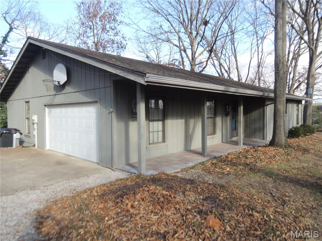 Lakefront home on Governor Bond Lake. Enjoy lakeside living in the beautiful ranch 3 bedroom, 2½ bath home perfectly situated on the lake. The spacious living room features a cozy gas fireplace and large windows with breathtaking views of the water. Partially finished basement with walk-out to your patio or enjoy your gas fireplace in the family room with a view of the lake. Step outside and you'll find your own private boat dock with easy access to the lake, perfect for boating, fishing, or simply relaxing in this peaceful setting. With a thoughtful layout, modern comforts, and an unbeatable location, this property offer both comfort and convenience for lake lovers. Don't miss the chance to make this lakeside retreat your next home!