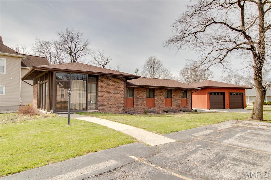 This solid brick home sits on a corner lot and offers plenty of space inside and out, along with a detached 2 car garage and additional off street parking pads.

The main level features a spacious living room, updated kitchen with stainless appliances, and a long mudroom for added functionality. You’ll also find a primary bedroom with a private 3/4 bath, 2 additional bedrooms (both with built-in desks), full bathroom, half bathroom, and convenient main floor laundry.

The finished lower level adds even more living space with a large family room, second kitchen with walk-in pantry, and an additional 3/4 bath, ideal for extended living or entertaining. Multiple storage areas and a second laundry setup provide plenty of flexibility.

A well-rounded home with room to spread out and plenty of practical features throughout!