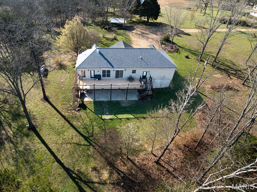 FAR AWAY OFF THE ROAD, HIDDEN IN A ALCOVE Finds this stunning custom built home by very talented Builder for his own personal use.  7 Dashing Acres with view-fest before you off the massive deck or patio, you cannot look out a window without the site of the Countryside.  2 bedrooms, 2.5 bath represents the best of life.  Cathedral Ceilings not only make focus on the beautiful fireplace they also have can lighting and a lit Ceiling fan shining on those simply gorgeous Floors.  There is a 1/2 bath for guest or game night handy.  This kitchen calls for a cook with a talent to put out the finest foods which is also open to the living room, front covered porch and back deck.  An Island makes use of seating or tons of space for gathering during large crowds.  There is a clever spot for a Dining room.  The Master is simply lush experience to lounge in. This en suite provides a private privy with a view.  The attached garage is a delight with great lighting, a sink and storage just what you ask for.  Down in the full walkout basement finds a perfect bar overlooking the beautiful countryside view, large space for your clan to gather, a darling bedroom with a Jack & Jill bathroom to share but lock for privacy.  This room is cozy and safe.  Hurry up, this won't last long.