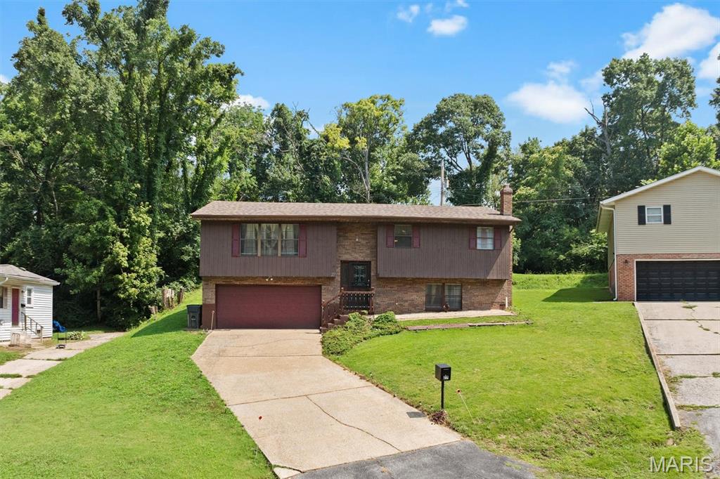 Check out this quality-built home situated on a quiet cul-de-sac.  The spilt-level has ample space with a large living room, a kitchen big enough to add an island or 2nd dining table, a separate dining room, 3 large bedrooms and 2 baths on the main level.  The lower level has a generous family room with a gas fireplace and a half bath.  The oversized garage will easily fit 2 vehicles with room for a workspace or extra tools and toys.  The deck on the back offers a quiet get-a-way for relaxing with a private fenced yard that backs up to trees.  Check this one out before it gets away.