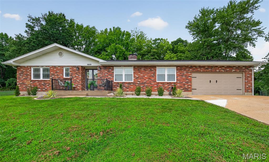 This 3-bedroom, 3-bath brick ranch blends classic charm with a long list of major 2025 upgrades, all set on an expansive double lot that backs directly to Upper Mastodon State Park. The result is a private, park-like retreat with modern comfort inside and resort-style living outside. The heart of the home has been refreshed with a bright, updated kitchen featuring new cabinetry, quartz countertops, a new range, and a built-in wine fridge. A newly added main-floor laundry room sits just off the kitchen for everyday convenience. Natural light fills the living spaces thanks to brand-new double-hung thermal replacement windows, while a new roof with architectural shingles adds peace of mind for years to come. Step outside through the new French door and discover your own backyard oasis. A stunning in-ground fiberglass pool—complete with a UV light cleaning system—anchors the outdoor living area. Fresh concrete surrounds the pool, creating a clean, modern space for lounging, entertaining, and enjoying the wooded backdrop of the state park. Both the hall and primary bath have been updated. The finished lower level features a spacious recreation room with a fireplace with wood-burning insert, a full bathroom, and a large storage area. Additional highlights include a new backyard fence and fresh concrete along the side of the home leading to the backyard, a new water heater, and a new garage door opener. With its rare double lot, thoughtful interior updates, and a backyard that feels like a private resort, this home offers a lifestyle that’s hard to match. It’s move-in ready, beautifully improved, and perfectly positioned for anyone who loves space, nature, and modern amenities.