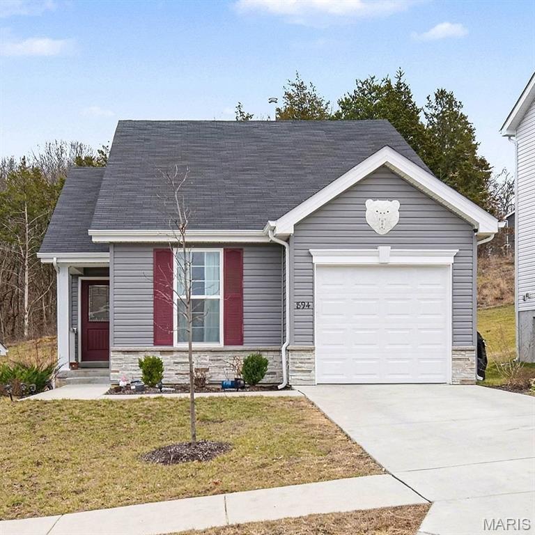 NEW PRICE! SELLERS ARE MOTIVATED! OPEN HOUSE SUNDAY!  Better than new! This house lives large! Perfect for 1st time home-buyer or buyer who is downsizing. MANY UPGRADES!  extra large garage and driveway, gorgeous WHITE OAK HARDWOOD FLOOR in common areas and upgraded appliances, purchased and installed after closing! Extra-long 6' windows allow the natural light to pour into all rooms! Beautiful kitchen with upgraded counter top, backsplash accented with unique hardware and lighting make the kitchen extra-special. Spacious primary offers double closets and is connected to bathroom! Storage area on main floor offers Washer/Dryer hook-up for convenient main floor laundry. Basement is well thought-out and ready for finishing with an egress window and full bath rough-in and Washer/Dryer connections for basement laundry option too! Basement still allows for lots of great storage! This is a bright and convenient floorplan, rich in upgrades that make for a luxurious lifestyle. Bear Ridge is a peaceful retreat nestled in Jefferson County, offering the perfect balance of privacy and convenience. Surrounded by wooded views and the charm of country living but just minutes from local amenities and shopping-this area offers it all!