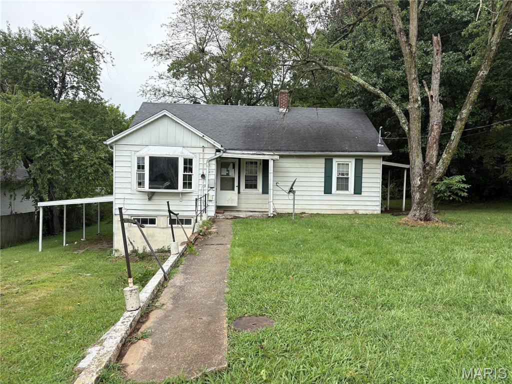 Built in 1950, this 3-bedroom, 1-bath bungalow offers an opportunity for an investor, renovator, or buyer looking for their next project. The home features a cozy eat-in kitchen, three bedrooms on the main level, and a full basement providing ample storage with convenient access from the side carport. Situated on a generous 0.60-acre lot, the property offers mature shade trees, a covered side porch, and plenty of outdoor space. Adding even more value and versatility is the 28x32 detached garage and workshop, built in 2007 and located at the rear of the property—ideal for vehicles, equipment, storage, or workspace. The home is in need of significant repairs and updating, making it well suited for someone prepared to renovate and unlock its potential. With its central Jackson location, spacious lot, and substantial garage/workshop, this property offers several appealing features to build upon. Bring your plans, your tools, and your vision for what this property could become.