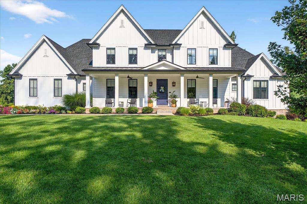 This well-crafted, custom built home sits on nearly a half acre lot in the sought after neighborhood of Hickory Hill. This modern farmhouse style home offers 5 bedrooms, 4 full baths, 2 half baths, 2 laundry areas, open floor plan and finished walk out lower level. Enjoy the multiple outdoor living areas: screened-in porch, front covered patio, new back patio with fireplace and built-in grill station, and lower walk-out patio. Large driveway and oversized 3 car garage features newly finished Epoxy floor and wall mounted storage system. Spacious entry off the garage provides nook with built-in wall of cubbies and drop zone, half bath, and large laundry room with built-in workspace. Welcoming front entry with dining room adorned in grasscloth and wainscoting. All will gather in the expansive kitchen, breakfast room, and living area with 10’ ceilings and gas fireplace flanked with window seats. In the kitchen you will find custom floor to ceiling cabinetry, Quartz tops, stainless-steel appliances, and walk-in pantry with second fridge. Enter the Primary suite through anteroom where you find coffered ceilings and newly renovated luxury bathroom with heated floors. Primary closet has ample storage and custom drawers. Second floor features bonus space, 3 bedrooms, 2 bathrooms, additional laundry room. The Lower Level is filled with natural light and 1700 sqft of finished living space as well as unfinished storage, full bath, and 5th bedroom. Seller prefers November 2025 close date.