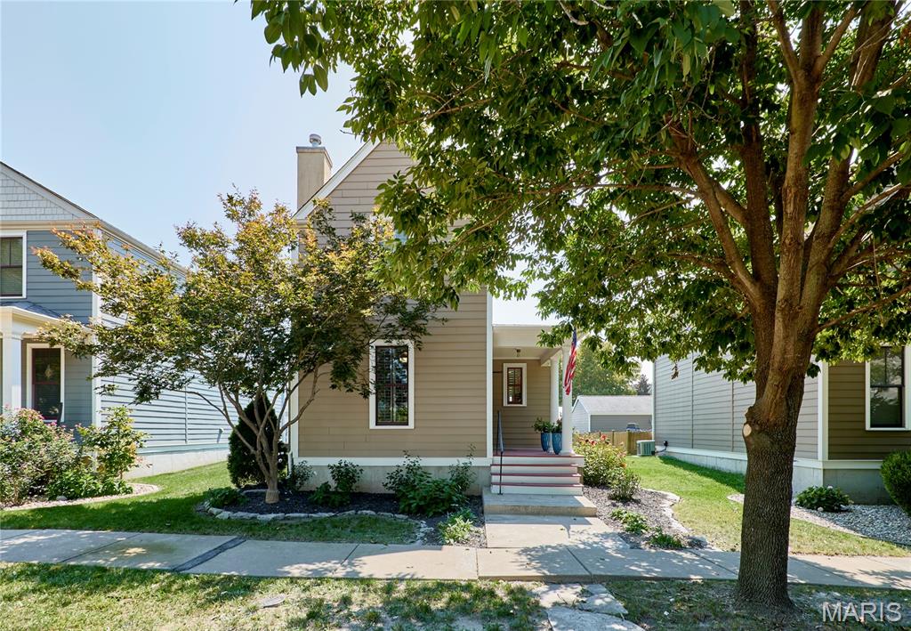 Welcome to this adorable story-and-a-half home perfectly situated in the heart of New Town – St. Charles! Completely updated and filled with character, this home offers the perfect blend of style, comfort, and functionality. Step inside to find freshly refinished hardwood floors spanning the main level and connecting the spacious family room and beautifully updated kitchen. The family room features a gorgeous gas fireplace, creating a warm and inviting space to relax or entertain. The kitchen is truly a showstopper, featuring solid-surface countertops, beautiful backsplash, custom cabinetry, and plenty of style and function. The main-floor owner's suite is a must-see, complete with a stunning spa-like private bathroom that feels like your own personal retreat. A convenient main-floor laundry and powder room round out the first floor. Upstairs, you'll find two generously sized bedrooms, a charming loft area, and another beautifully updated full bathroom, providing plenty of space for family, guests, an office, or whatever your lifestyle requires. Step outside to enjoy the good-sized backyard and patio, perfect for relaxing or entertaining, with convenient access to the detached two-car garage. And there's even more potential downstairs! The basement is ready for your finishing touches and already includes a rough-in for a future bathroom, giving you the opportunity to create additional living, entertaining, or recreation space. All of this in the heart of New Town, surrounded by the charm, amenities, walkability, and lifestyle that make this one of St. Charles' most desirable communities. This one is truly move-in ready and ready to welcome its next owner!